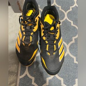 Black and yellow Adidas  baseball cleats